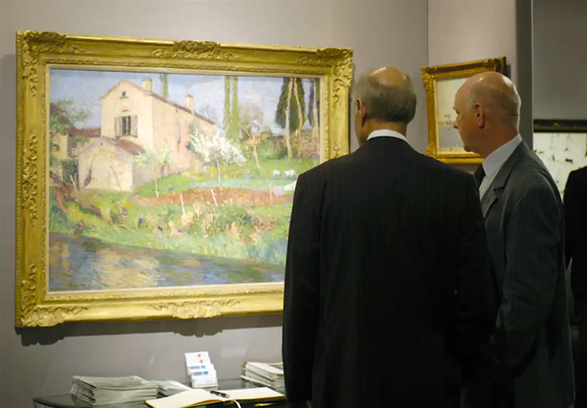 art advisors observing artwork in a gallery