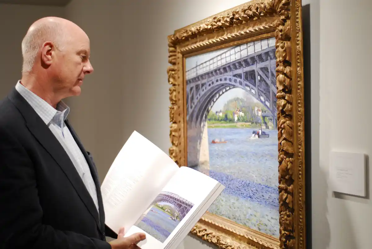 art advisor viewing a painting