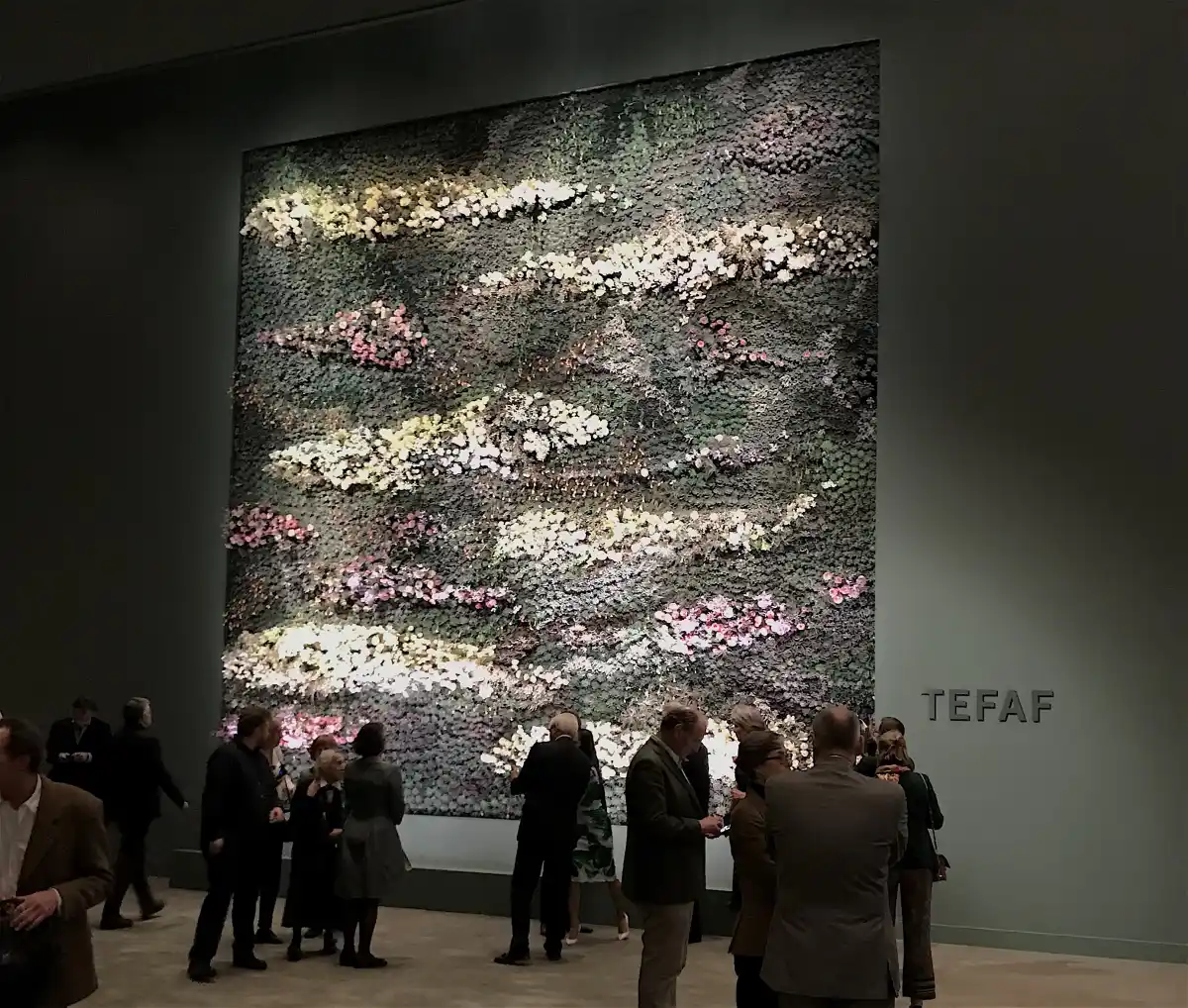 people viewing painting