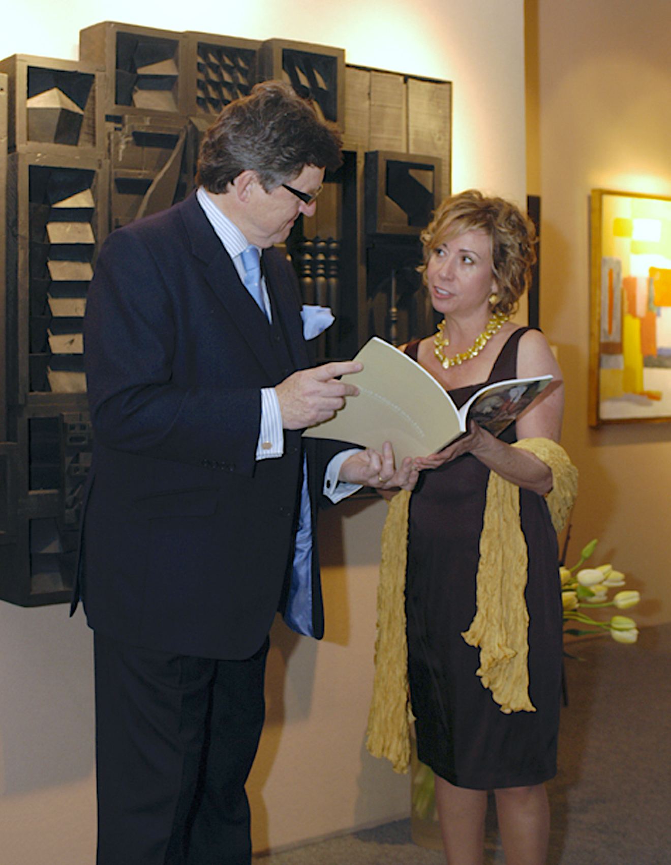 Jonathan Dodd discussing an artwork with another dealer Jonathan Dodd discussing an artwork with another dealer