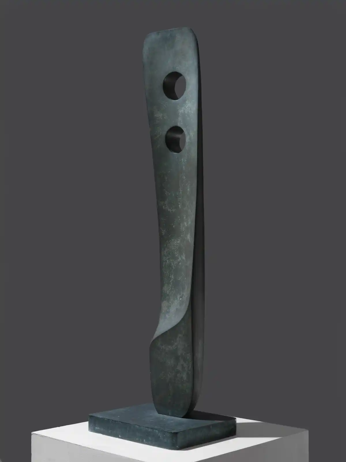 Single Form (Aloe), a small bronze sculpture by Barbara Hepworth with two holes through a verticle plank